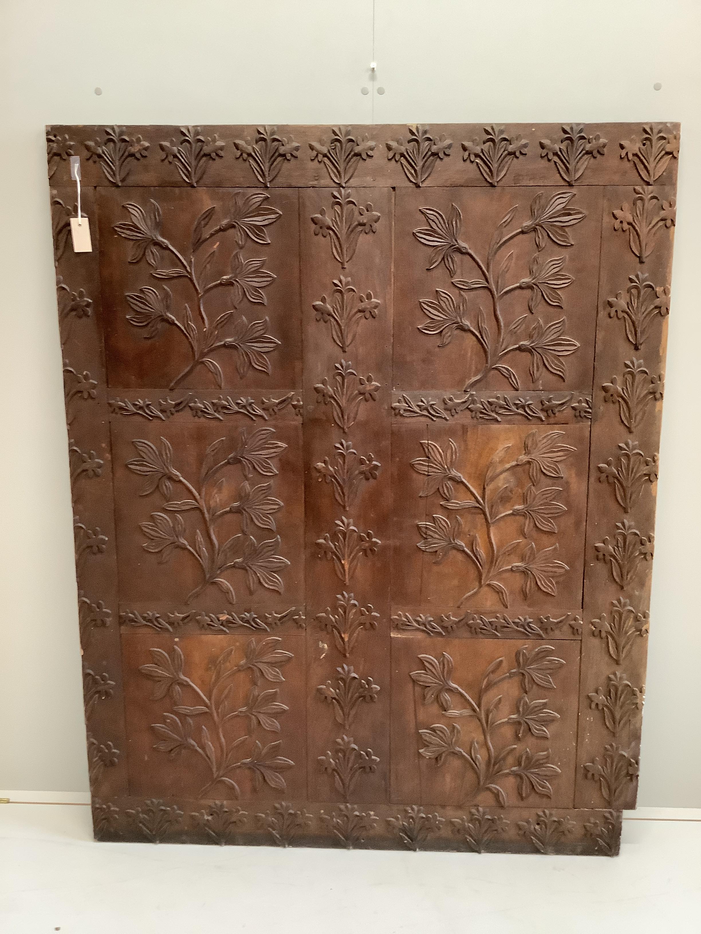 An Indonesian rectangular carved hardwood panel, width 134cm, height 170cm